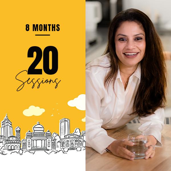 A smiling woman with long brown hair sits on a couch, next to a yellow background with "21" in bold black and white balloons and confetti below. Celebratory tone.