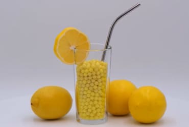 Fresh orange juice glass with sliced oranges