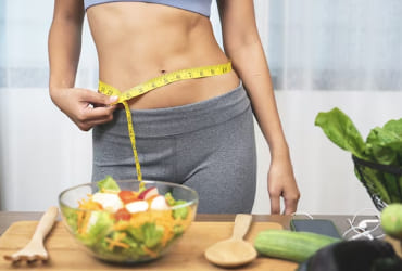Chopping colorful veggies on wooden board