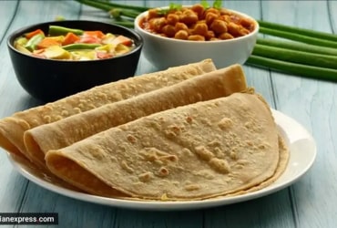 Sandwich and soup plate on shiny surface