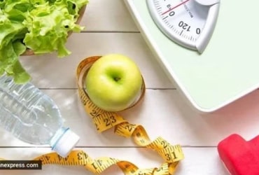 Green apple, scale, tape flat lay