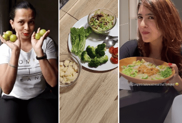 Two hands hold stacked veggie sandwiches