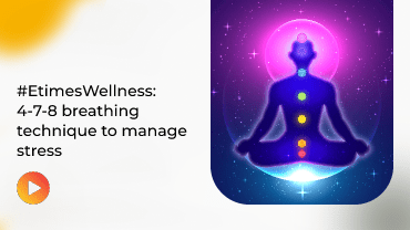 Person meditates within glowing purple aura