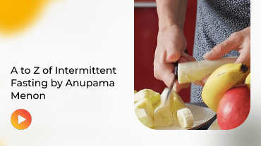 Person in yellow hard hat holding blueprint roll